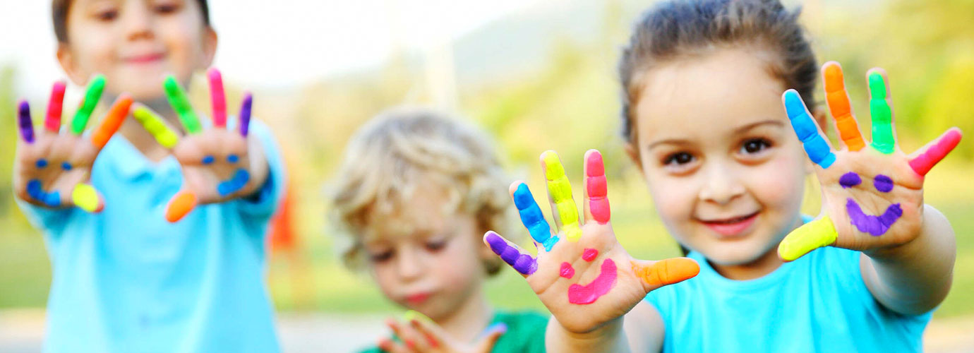 Toddler kids playing with finger paint