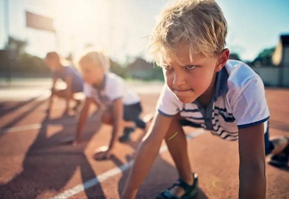 Kids preparing to run a race at summer camp