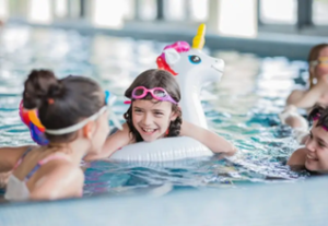 Kids enjoying the pool at swimming pool party