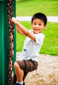 Young boy playing in playground