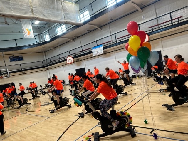 A group of people using a treadmill on a basketball court in Central Massachusetts